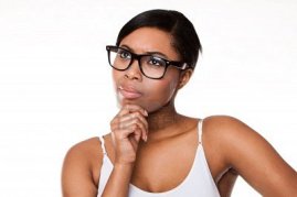 Black-woman-thinking-wearing-glasses-on-white